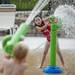 Chelsea resident Ireland Potter, 6, aims a water canon at Blue Heron Bay at Independence Lake on Saturday, July 6. Daniel Brenner I AnnArbor.com
